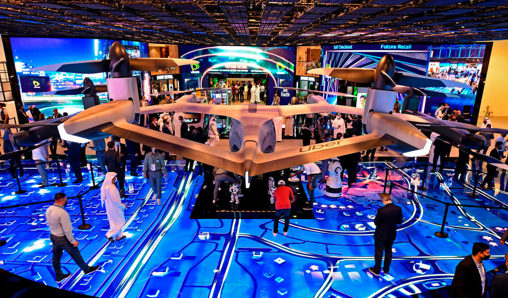 Visitors look at flying concept car during the GITEX 2020